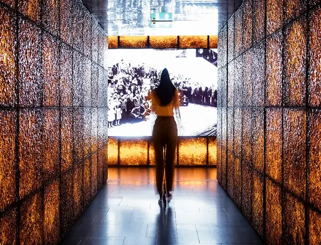 Photo of a visitor in the hallway of the super bock beer house  