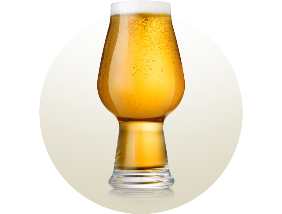 Modern IPA beer glass, with a narrow base and a body that widens in the middle and toward the top, filled with golden beer and a creamy head, designed to enhance hop aromas and preserve carbonation.